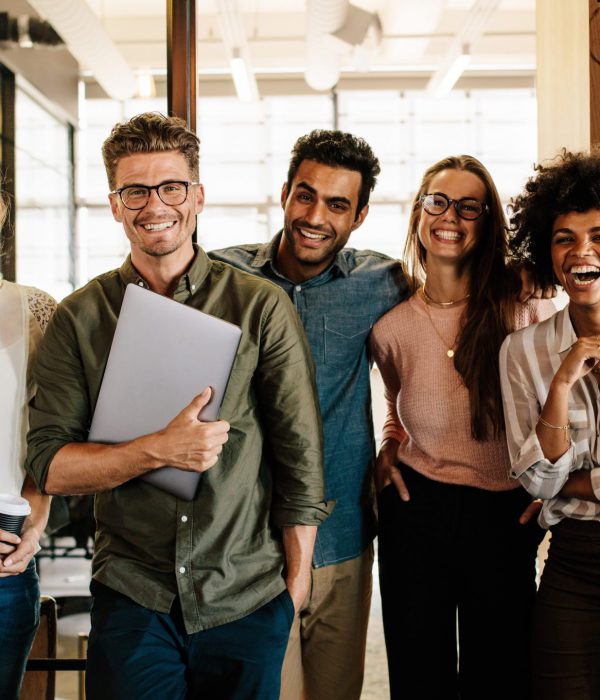 Portrait,Of,Creative,Business,Team,Standing,Together,And,Laughing.,Multiracial